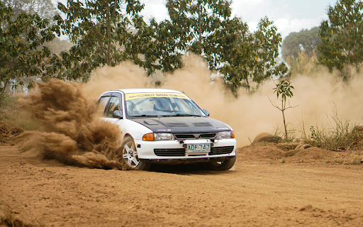 A car driving on a dirt road with dust flying up from Chrome web store to be run with OffiDocs Chromium online A car driving on a dirt road with dust flying up from Chrome web store to be run with OffiDocs Chromium online